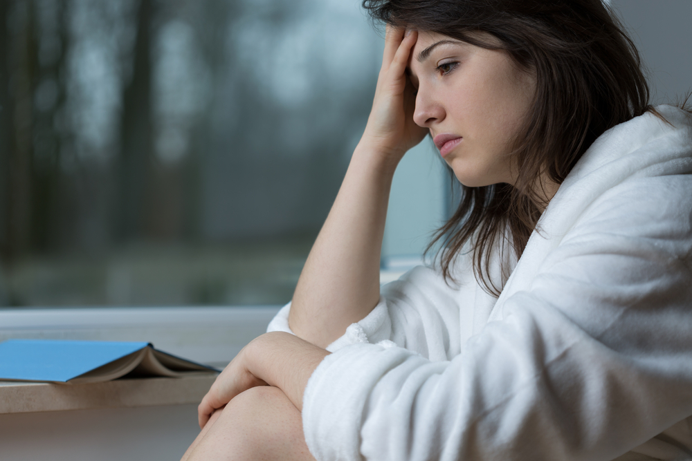 Young depressed woman thinking about her problems Young depressed woman thinking about her problems